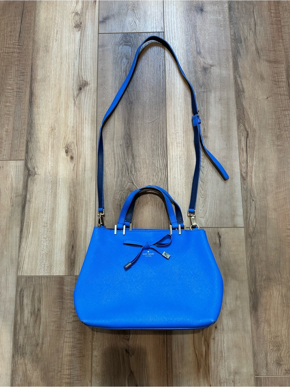 Kate Spade Vibrant Blue shoulder bag featuring a delicate bow detail